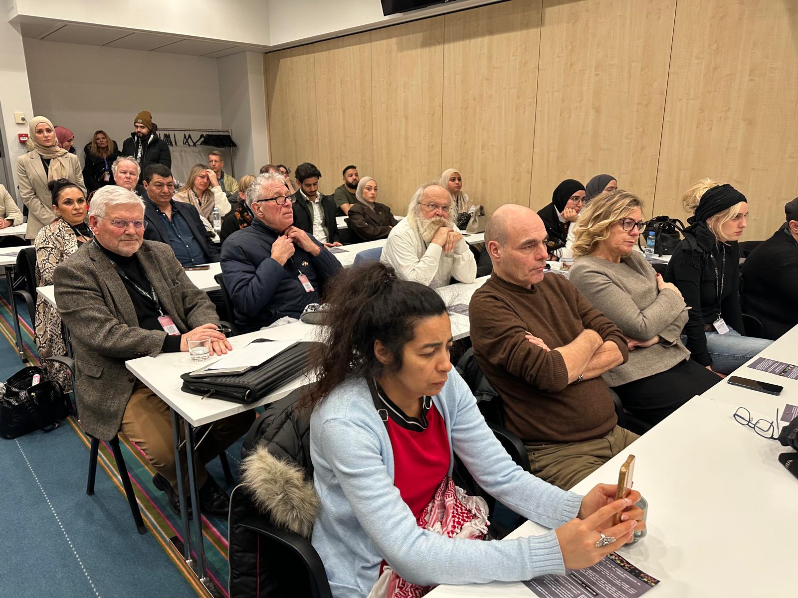 Seated audience in the seminar room.